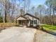 Attractive single-story home with neutral siding, brick accents, manicured landscaping, and a concrete driveway at 350 Belvedere Nw Dr, Concord, NC 28027