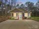 Charming single-story home with neutral siding, brick accents, a well-manicured lawn, and a spacious concrete driveway at 350 Belvedere Nw Dr, Concord, NC 28027