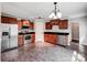 Modern kitchen featuring stainless steel appliances, wood cabinets, and sleek countertops at 350 Belvedere Nw Dr, Concord, NC 28027