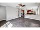 Inviting living room with sleek dark wood flooring, stainless steel appliances and modern ceiling fan at 350 Belvedere Nw Dr, Concord, NC 28027