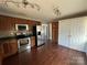 Kitchen with stainless appliances, wood cabinets, and tile backsplash at 3915 Crestridge Dr, Charlotte, NC 28217