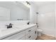 Bathroom featuring double sinks, black hardware, modern vanity and shower-tub combo at 409 Bost St, Kannapolis, NC 28081