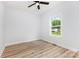 Bedroom featuring wood-look flooring and large windows providing ample natural light at 409 Bost St, Kannapolis, NC 28081