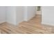 Stylish entryway showcasing wood flooring, white walls, and a glass-paneled front door at 409 Bost St, Kannapolis, NC 28081