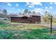 Charming two-story home with rustic wood siding and a well-maintained front yard at 455 Pinhook Loop Rd, Gastonia, NC 28056