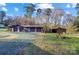 Large detached garage with multiple bays, offering ample storage and parking space at 455 Pinhook Loop Rd, Gastonia, NC 28056