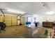 A look inside the garage with a garage door, chairs, and other stored items at 455 Pinhook Loop Rd, Gastonia, NC 28056