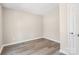 This bedroom features wood-look floors, neutral walls, and a closet at 4931 Galax Dr, Charlotte, NC 28213