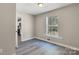 This bedroom features neutral walls, wood-look floors, and a window at 4931 Galax Dr, Charlotte, NC 28213