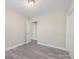Neutral bedroom with a closet, sleek gray floors, and a doorway at 4931 Galax Dr, Charlotte, NC 28213