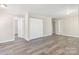 Spacious living room with lots of closets, light gray walls, and sleek floors at 4931 Galax Dr, Charlotte, NC 28213