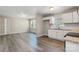 Bright living room and kitchen, with sleek floors and light gray walls at 4931 Galax Dr, Charlotte, NC 28213