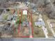 Aerial view showcasing the property with approximate lot lines, surrounding neighborhood, and nearby houses at 5412 Carving Tree Dr, Harrisburg, NC 28075