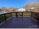 Spacious back deck with wood railing, perfect for outdoor entertaining and enjoying backyard views at 5412 Carving Tree Dr, Harrisburg, NC 28075