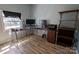 Functional home office with desk, shelves, and natural light, ideal for remote work at 5412 Carving Tree Dr, Harrisburg, NC 28075