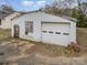 Exterior of 602 Bethpage Rd with a garage door and brick details at 602 Bethpage Rd, Kannapolis, NC 28081