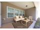 Relaxing outdoor space features neutral toned furniture and accessories at 6615 Buck Horn Pl, Waxhaw, NC 28173