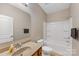 This bathroom includes a single sink vanity, toilet and bathtub with shower at 6615 Buck Horn Pl, Waxhaw, NC 28173