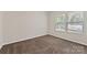 Bedroom showing neutral walls and carpet, plus a window with blinds at 6615 Buck Horn Pl, Waxhaw, NC 28173