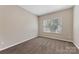Bedroom showing neutral walls and carpet, plus a window with blinds at 6615 Buck Horn Pl, Waxhaw, NC 28173