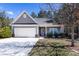 Charming single-Gathering home with a well-maintained lawn and inviting front porch on a sunny day at 6615 Buck Horn Pl, Waxhaw, NC 28173