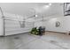 View of garage with garage door open showing riding lawn mower and mechanicals at 6615 Buck Horn Pl, Waxhaw, NC 28173