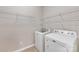 Bright laundry room equipped with modern, white washer and dryer at 6615 Buck Horn Pl, Waxhaw, NC 28173