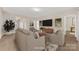 Staged living room featuring comfortable seating and neutral color palette at 6615 Buck Horn Pl, Waxhaw, NC 28173