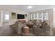 Staged living room with a comfortable seating area and lots of natural light at 6615 Buck Horn Pl, Waxhaw, NC 28173