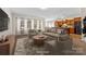 Bright living room with many windows and neutral color palette at 6615 Buck Horn Pl, Waxhaw, NC 28173