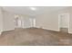 Open living room space with neutral color palette and ample natural light at 6615 Buck Horn Pl, Waxhaw, NC 28173