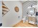 Chic powder room featuring patterned wallpaper, modern fixtures, and stylish wood accents at 805 E 19Th St, Charlotte, NC 28205