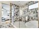 Modern bathroom with a glass shower, soaking tub, and geometric patterned tile at 805 E 19Th St, Charlotte, NC 28205