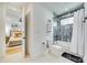 Clean and bright bathroom featuring modern fixtures, a shower/tub combination, and convenient towel storage at 805 E 19Th St, Charlotte, NC 28205