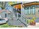 Gray fenced front porch with matching gray steps and tidy landscaping at 805 E 19Th St, Charlotte, NC 28205