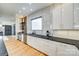 Stylish kitchen with sleek countertops, modern appliances, and a view into the dining area at 805 E 19Th St, Charlotte, NC 28205