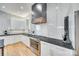 Well-appointed kitchen with stainless steel oven and a contemporary range hood, perfect for cooking at 805 E 19Th St, Charlotte, NC 28205