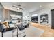 Bright living room with white sofa, dark wood accents, and hardwood flooring at 805 E 19Th St, Charlotte, NC 28205