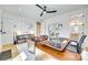 Bright home office with hardwood floors, ample desk space, bookshelves, and two leather chairs at 805 E 19Th St, Charlotte, NC 28205