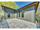 Modern outdoor patio space with a geometric tile floor and neutral-toned siding at 805 E 19Th St, Charlotte, NC 28205