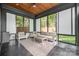Relaxing sunroom with comfortable seating, a ceiling fan, and plenty of natural light at 805 E 19Th St, Charlotte, NC 28205