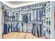 Spacious walk-in closet with custom shelving, hanging rods, and ample storage for clothing and shoes at 805 E 19Th St, Charlotte, NC 28205