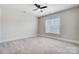 Bedroom features neutral walls, plush carpeting, and a window at 8513 Garden View Dr, Charlotte, NC 28277