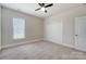 Bright bedroom features neutral walls, plush carpeting, and a closet at 8513 Garden View Dr, Charlotte, NC 28277