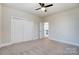 Bedroom featuring double-door closet and doorway to hallway at 8513 Garden View Dr, Charlotte, NC 28277