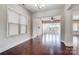 Dining area with hardwood floors, chandelier, and natural light from large windows at 8513 Garden View Dr, Charlotte, NC 28277