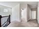 Hallway with view to ceiling fan and adjoining rooms with neutral carpet at 8513 Garden View Dr, Charlotte, NC 28277