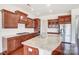 Modern kitchen with granite countertops, stainless steel appliances, and custom wood cabinets at 8513 Garden View Dr, Charlotte, NC 28277