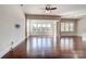 Open living space featuring hardwood floors and view of windows at 8513 Garden View Dr, Charlotte, NC 28277