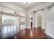 Spacious open-concept living room featuring hardwood floors and large windows for ample natural light at 8513 Garden View Dr, Charlotte, NC 28277